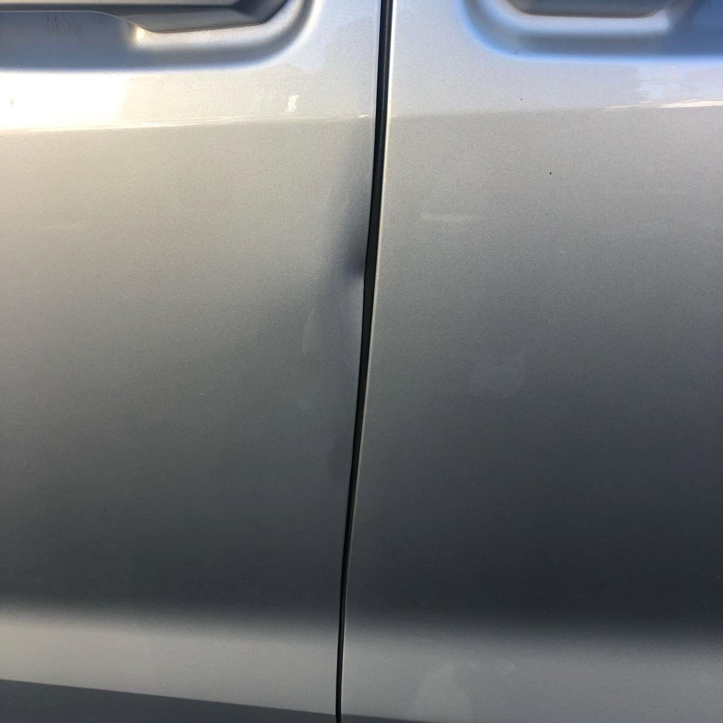 Vehicle dent before paintless repair