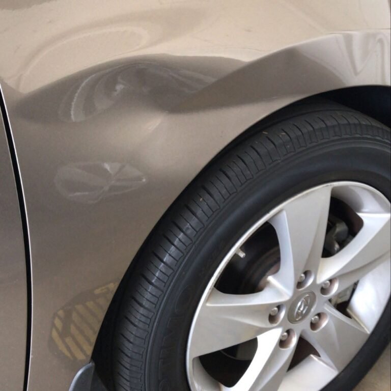 Multiple dents on car panel before PDR repair