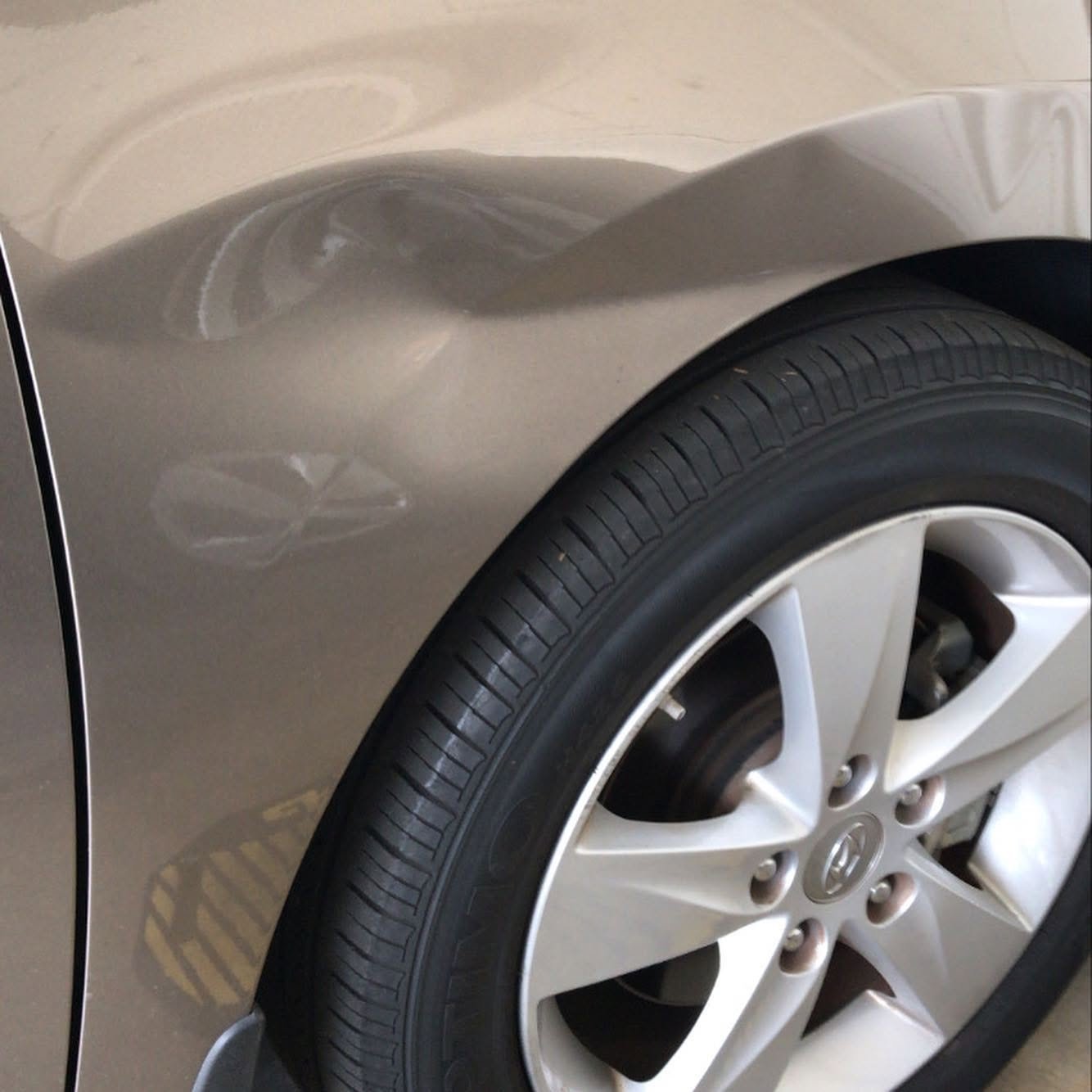 Multiple dents on car panel before PDR repair